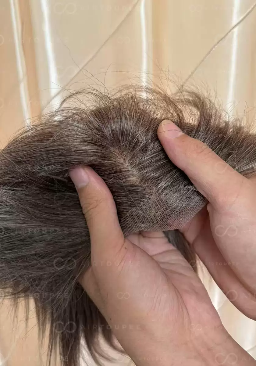 Size 9.5x6.3 inches with silk base brown color with 35% grey hair mixed lace in hairline very natural look